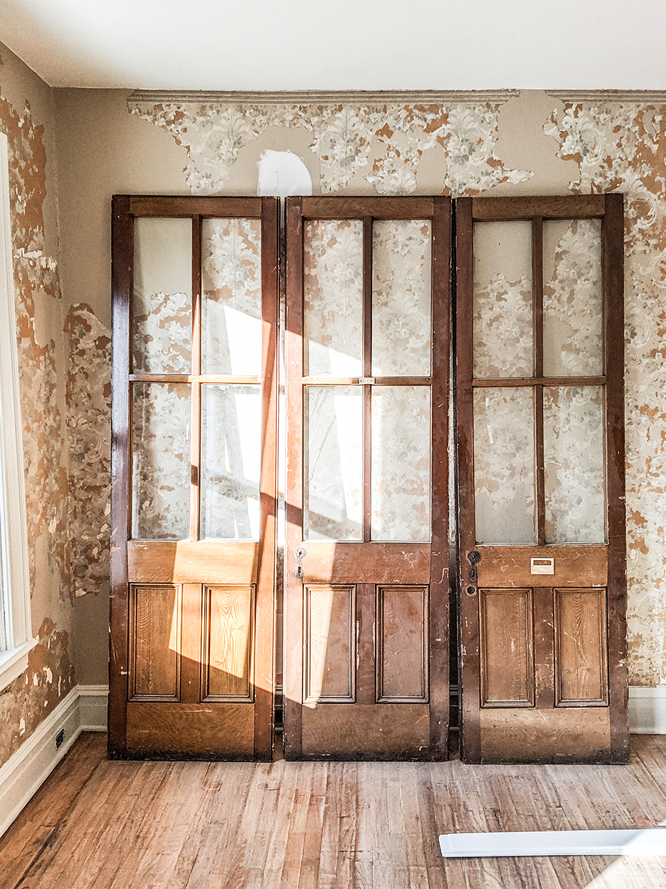 old barn doors propped against a wall