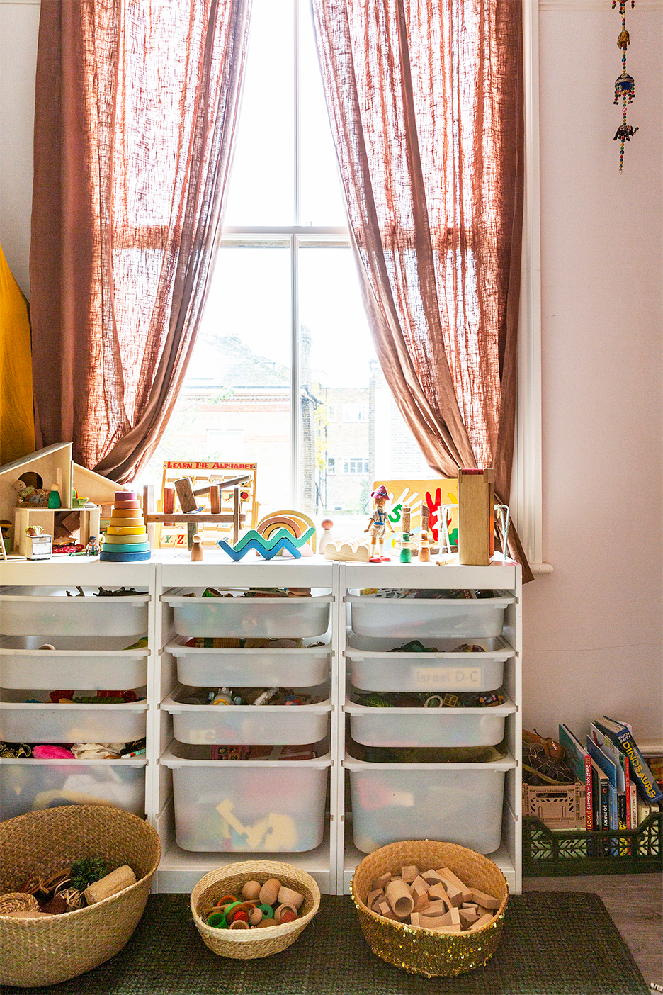 storage unit topped with toys