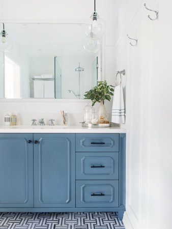 white bathroom with light blue sink unit