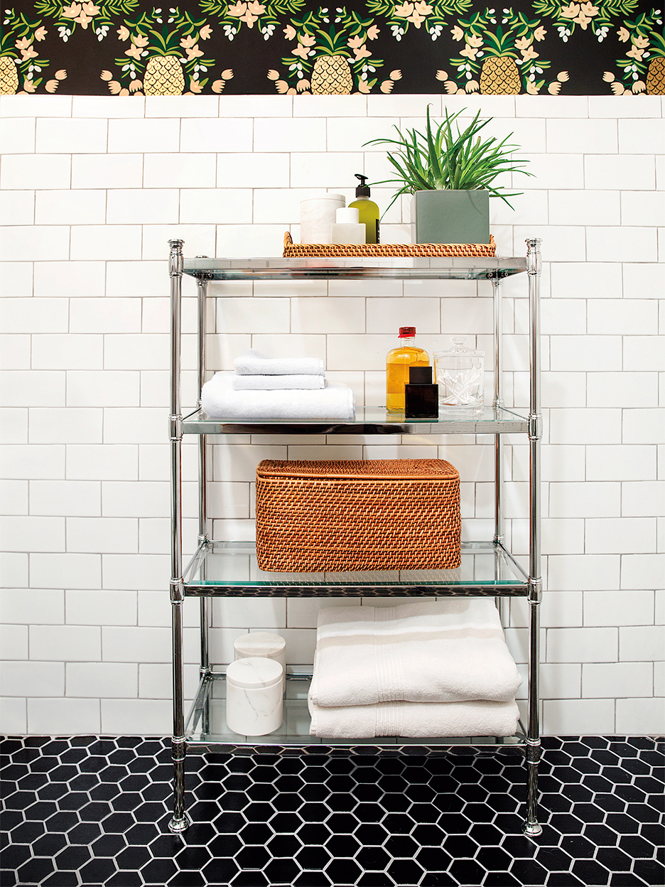 black tile floor white subway tile wall bathroom with chrome cart