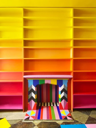 ombre bookshelf with painted and tile fireplace