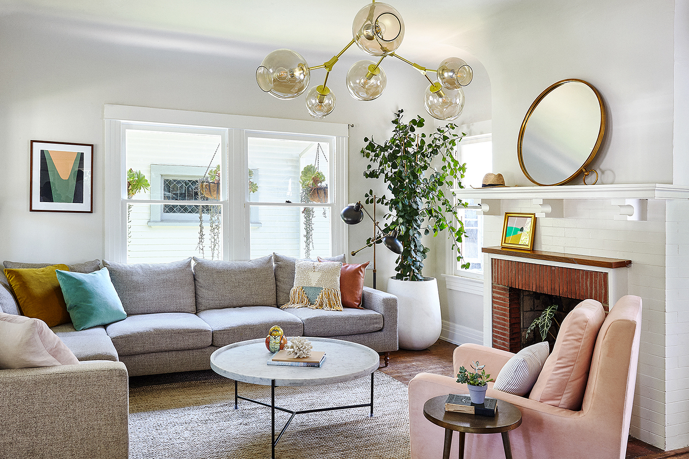 Living room with gray sofa and pink chair