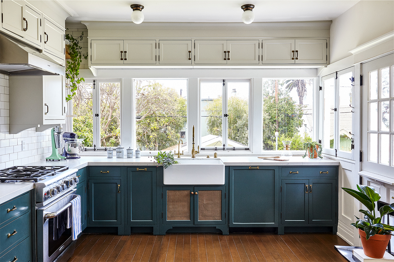 Traditional kitchen with navy lower cabinets