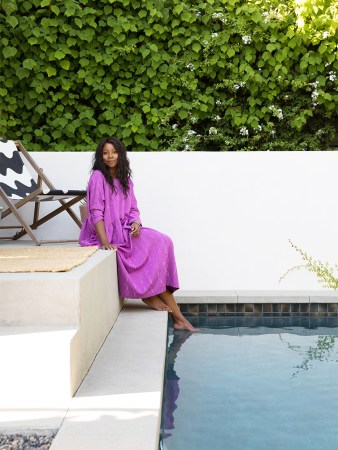 camilla Blackett sitting by pool