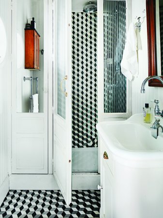 black and white geometric tiles in white bathroom