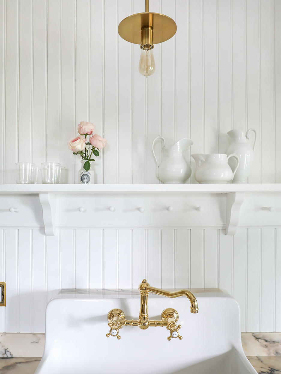 white shiplap wall with shaker pegboard