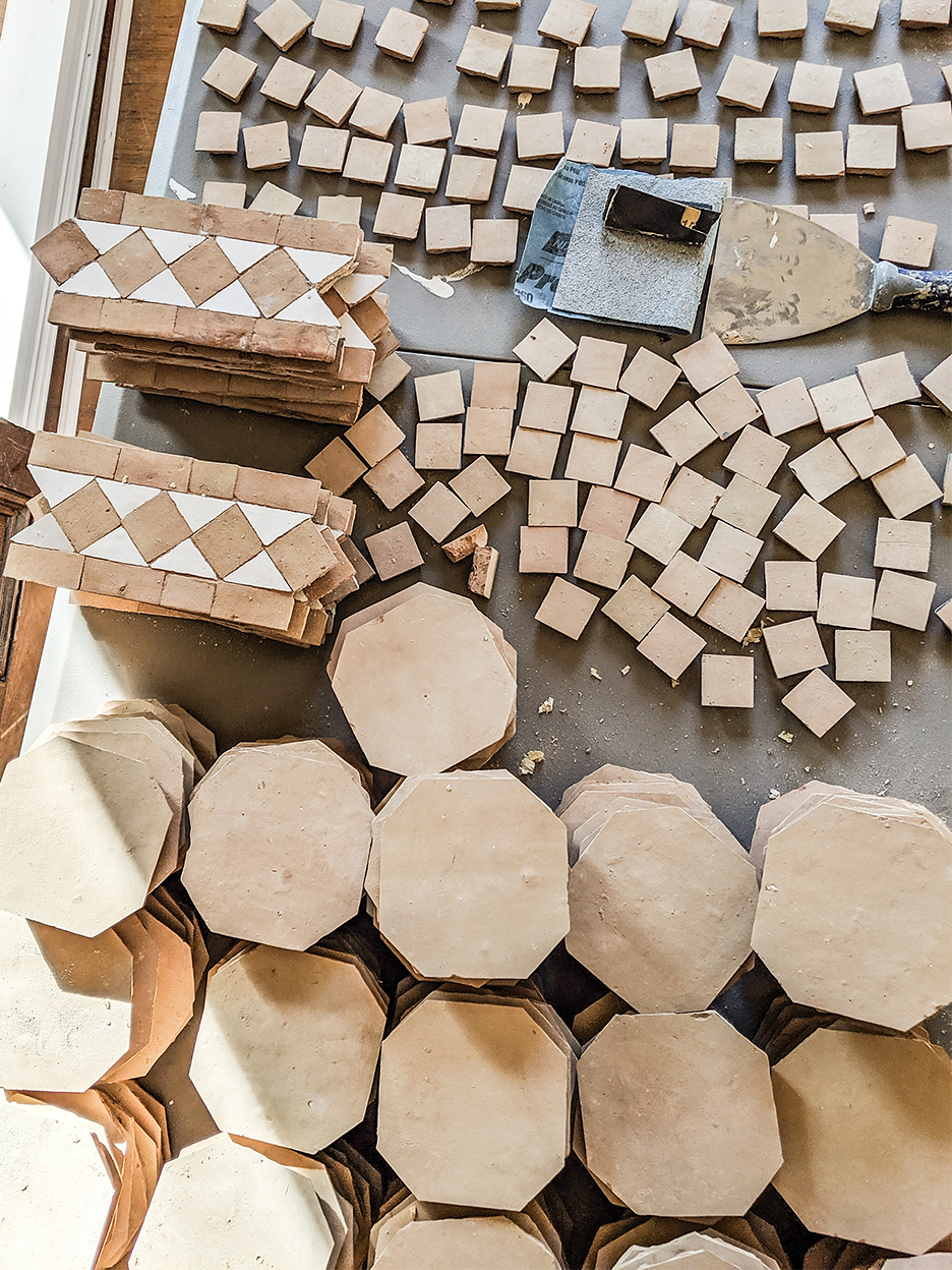 terracotta tiles laid out on surface