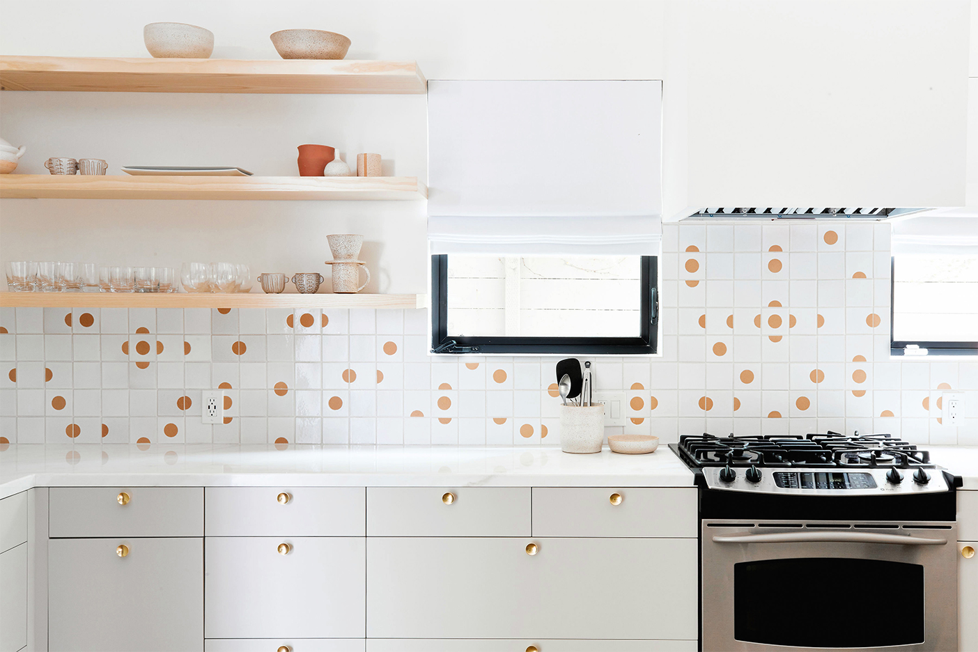 orange and white tile backsplash