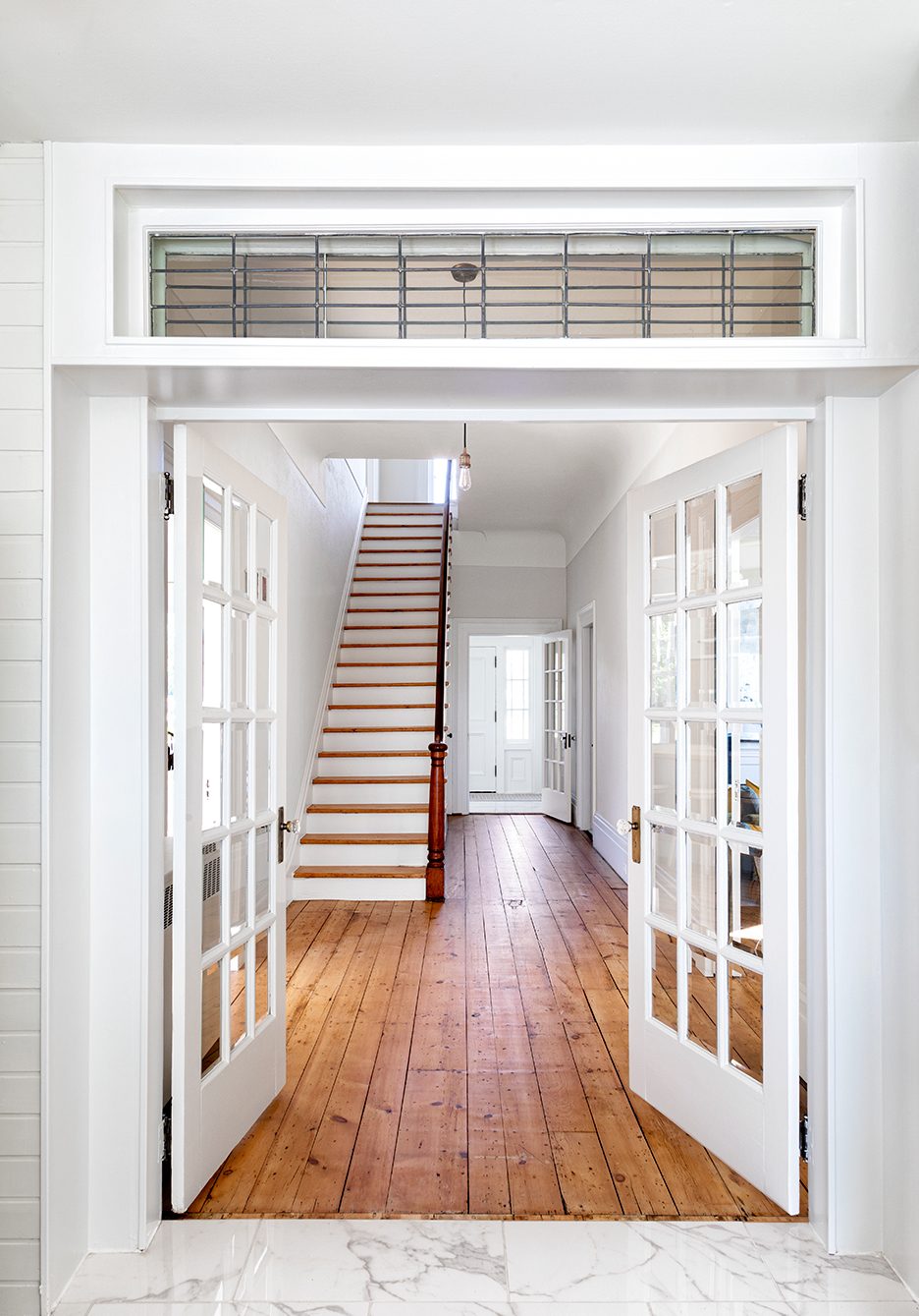 Georgian center-hall staircase with french doors