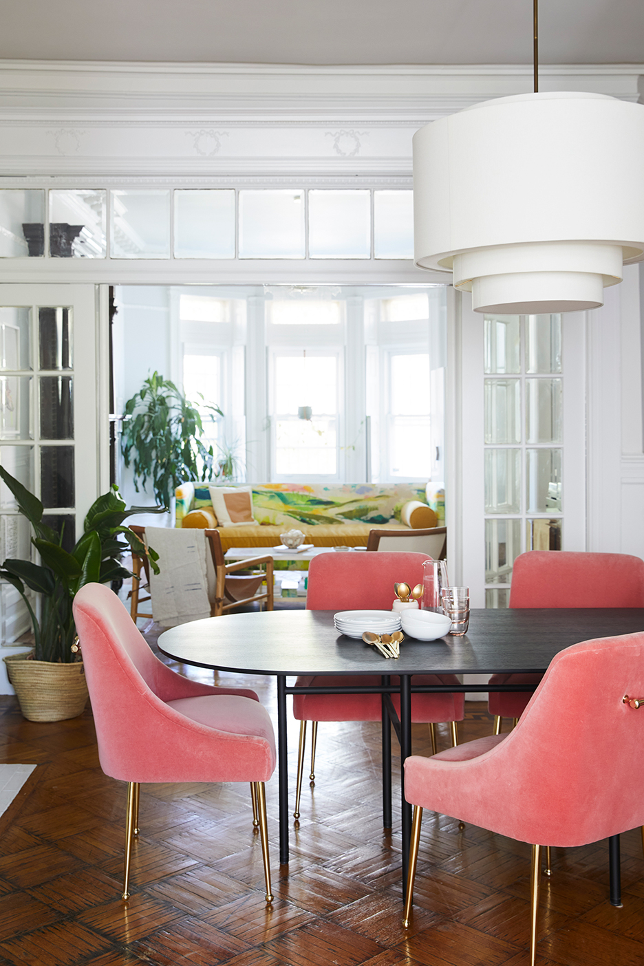 Dining room with pink chairs