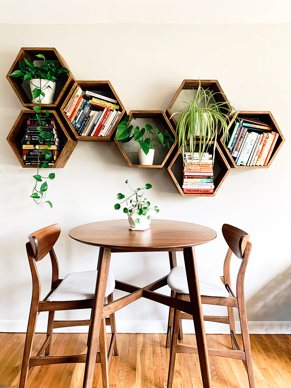 dining table below honeycomb bookshelves