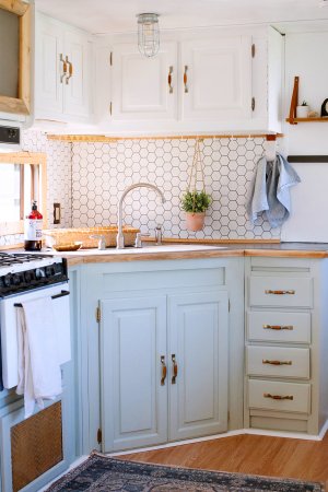 rv kitchen with light blue cabinets