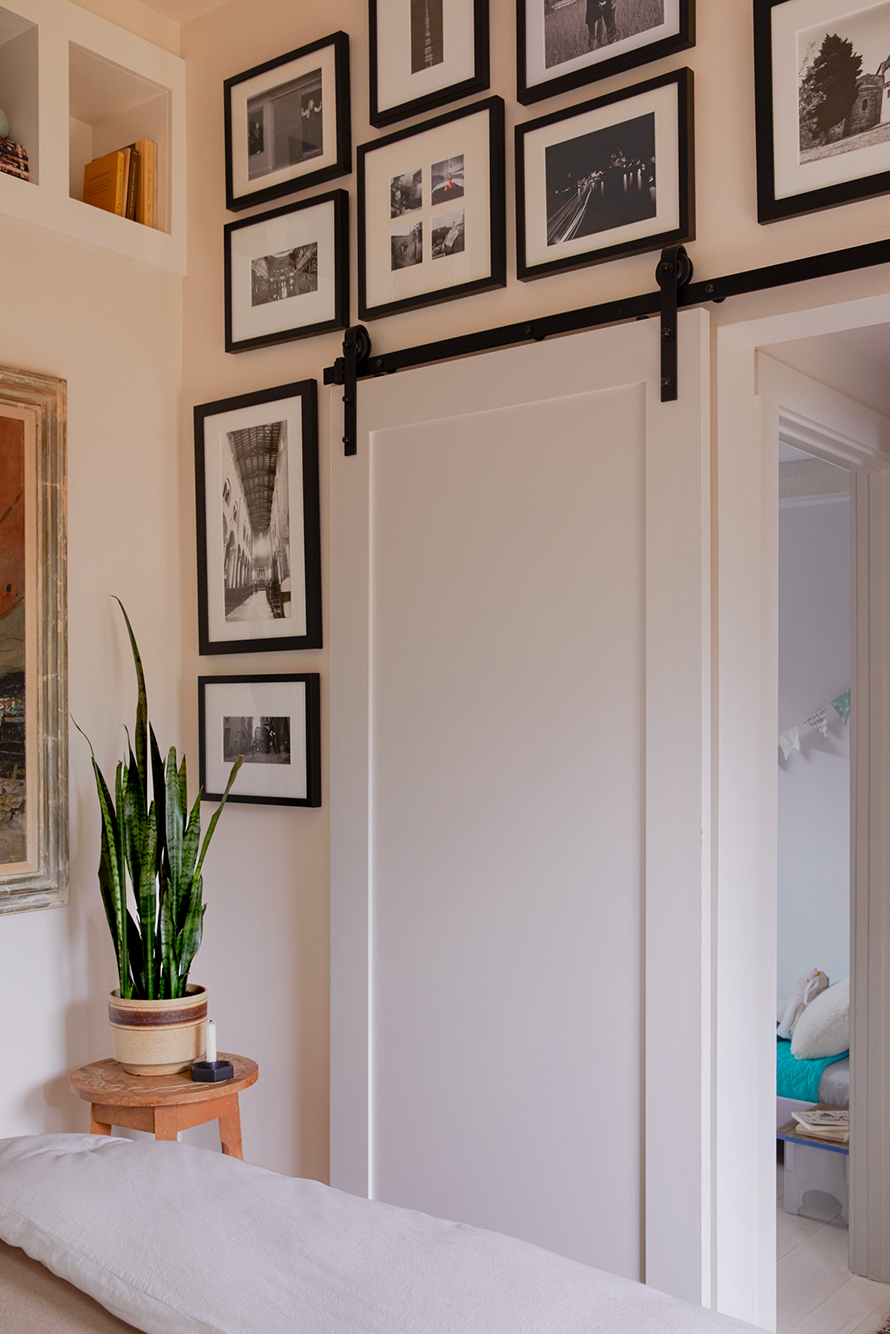 Corner of bedroom with gallery wall