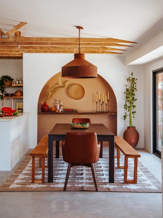 dining room with orange arch