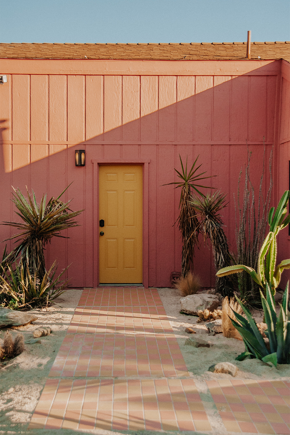 pink house with yellow door