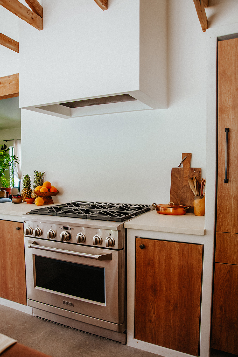 white kitchen with wood doors