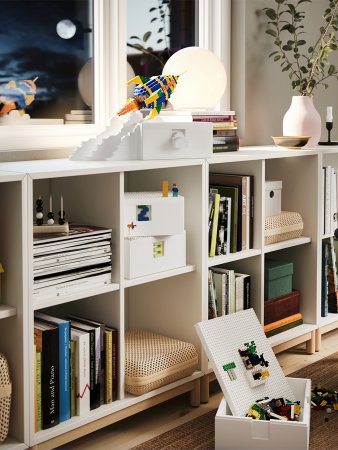 lego set on top of white bookshelf