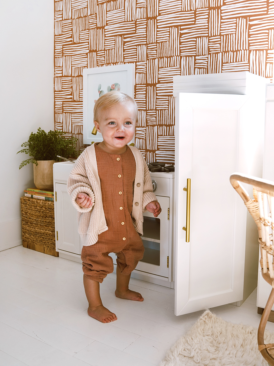 baby openign door of a fridge