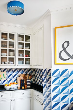 Kitchen with fun blue backsplash