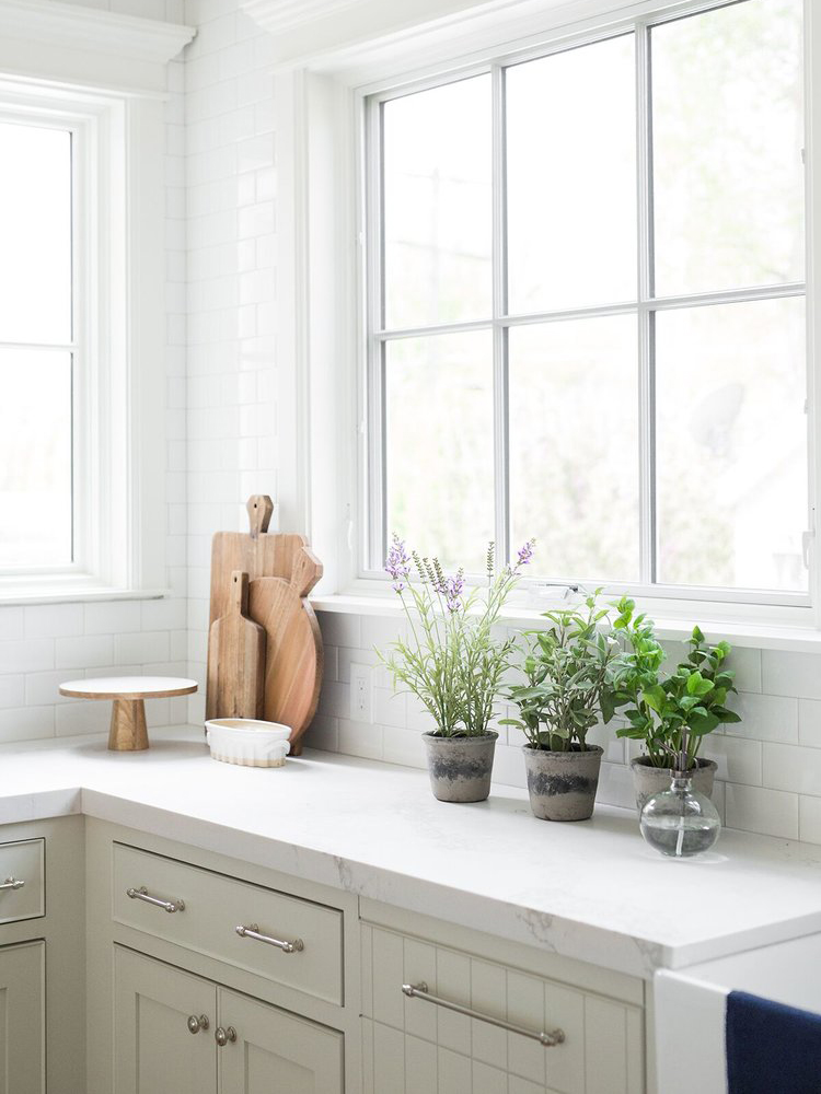 grey kitchen cabinets in all white kitchen