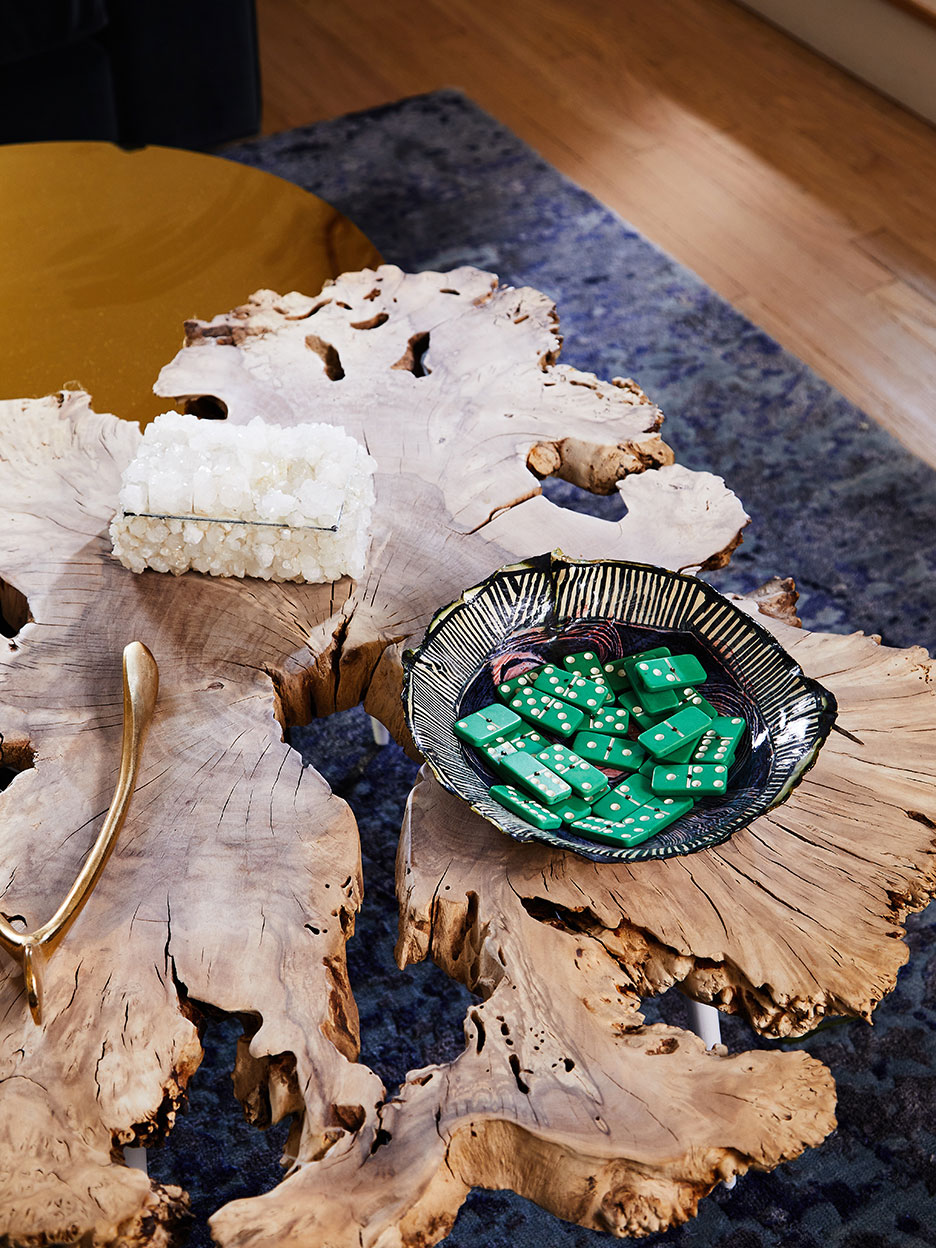 wood coffee table with bowl of dominoes