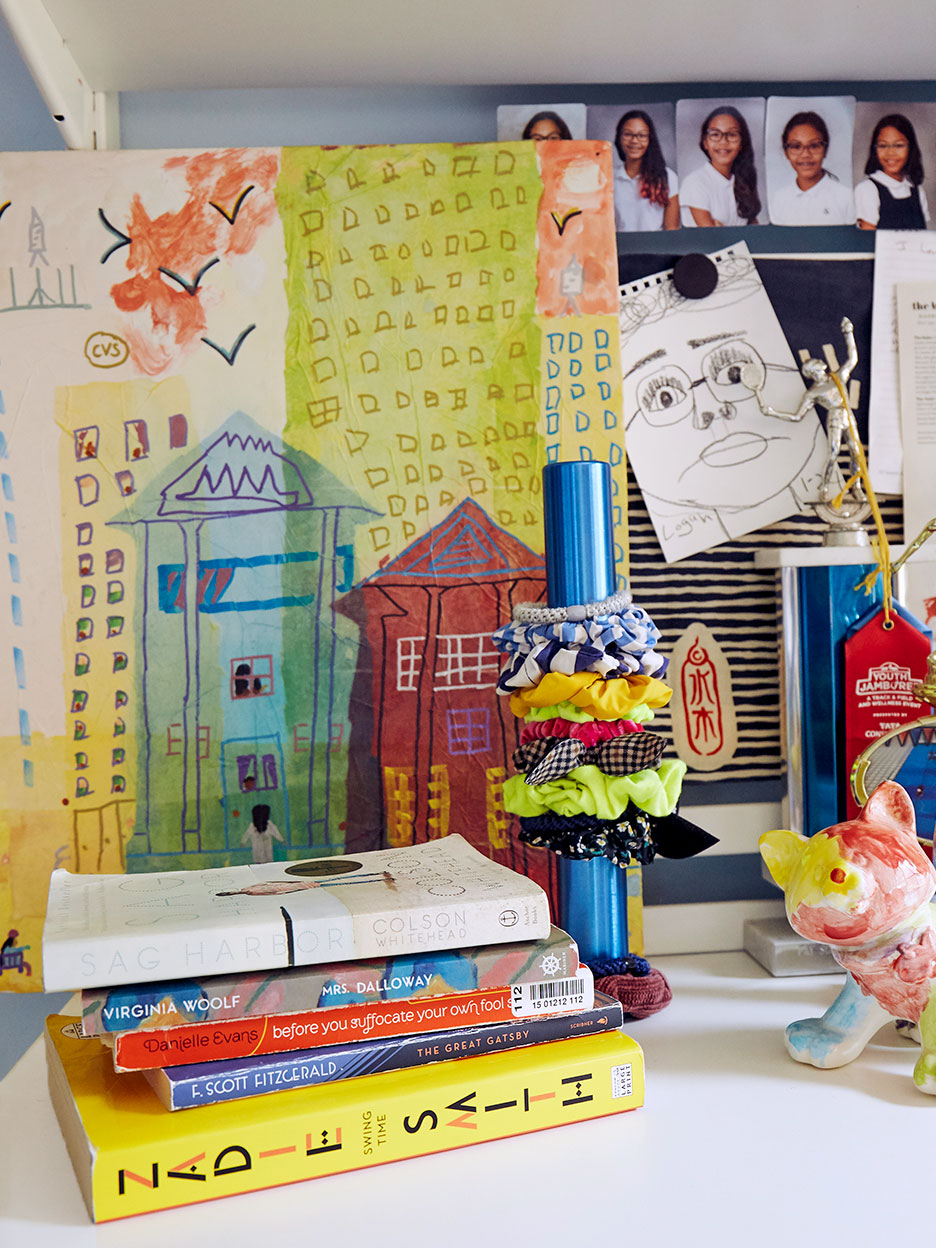 Corner of desk with books