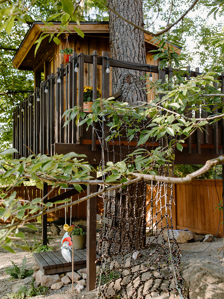 brown treeehouse with deck