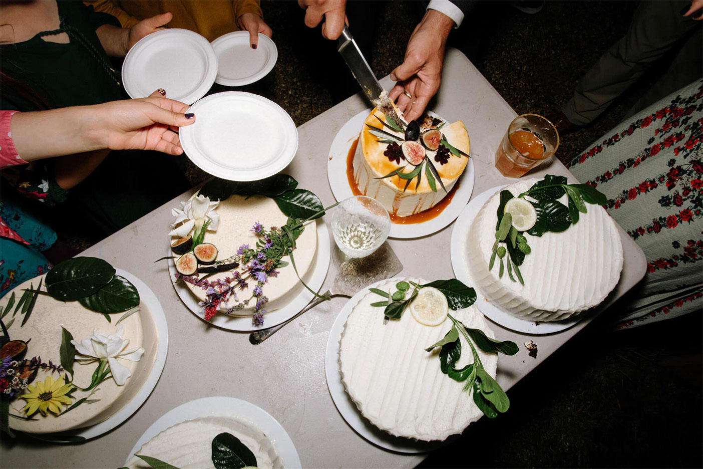 wedding cakes being cut