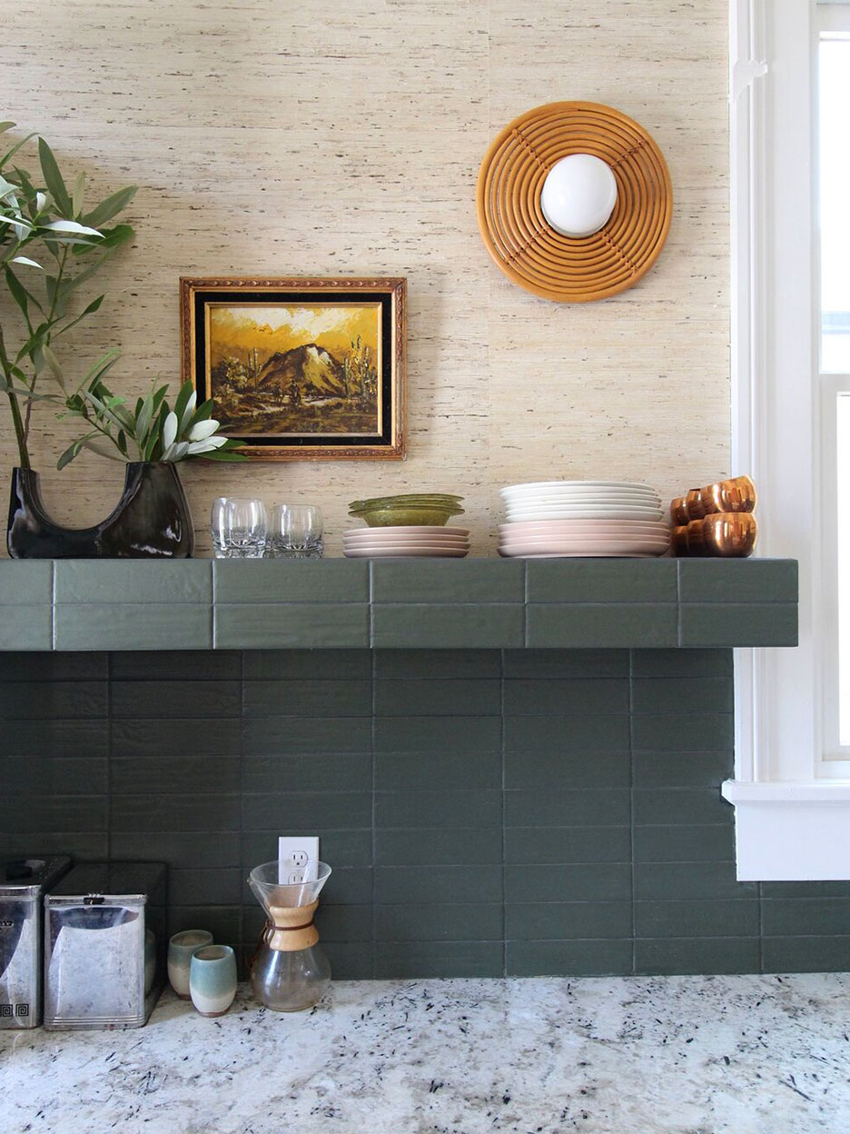 Green tiled open shelf above countertops