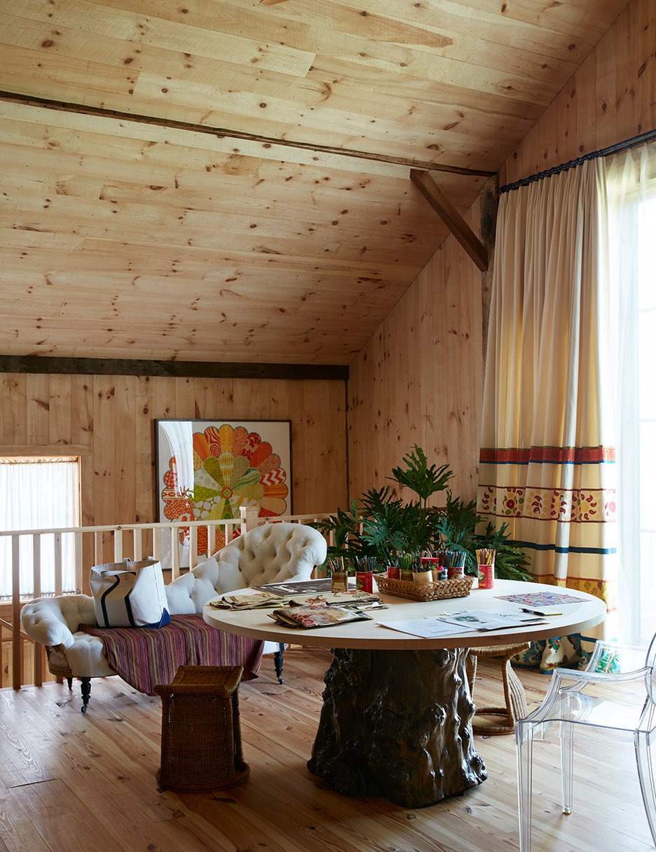 Round table in wood-paneled room