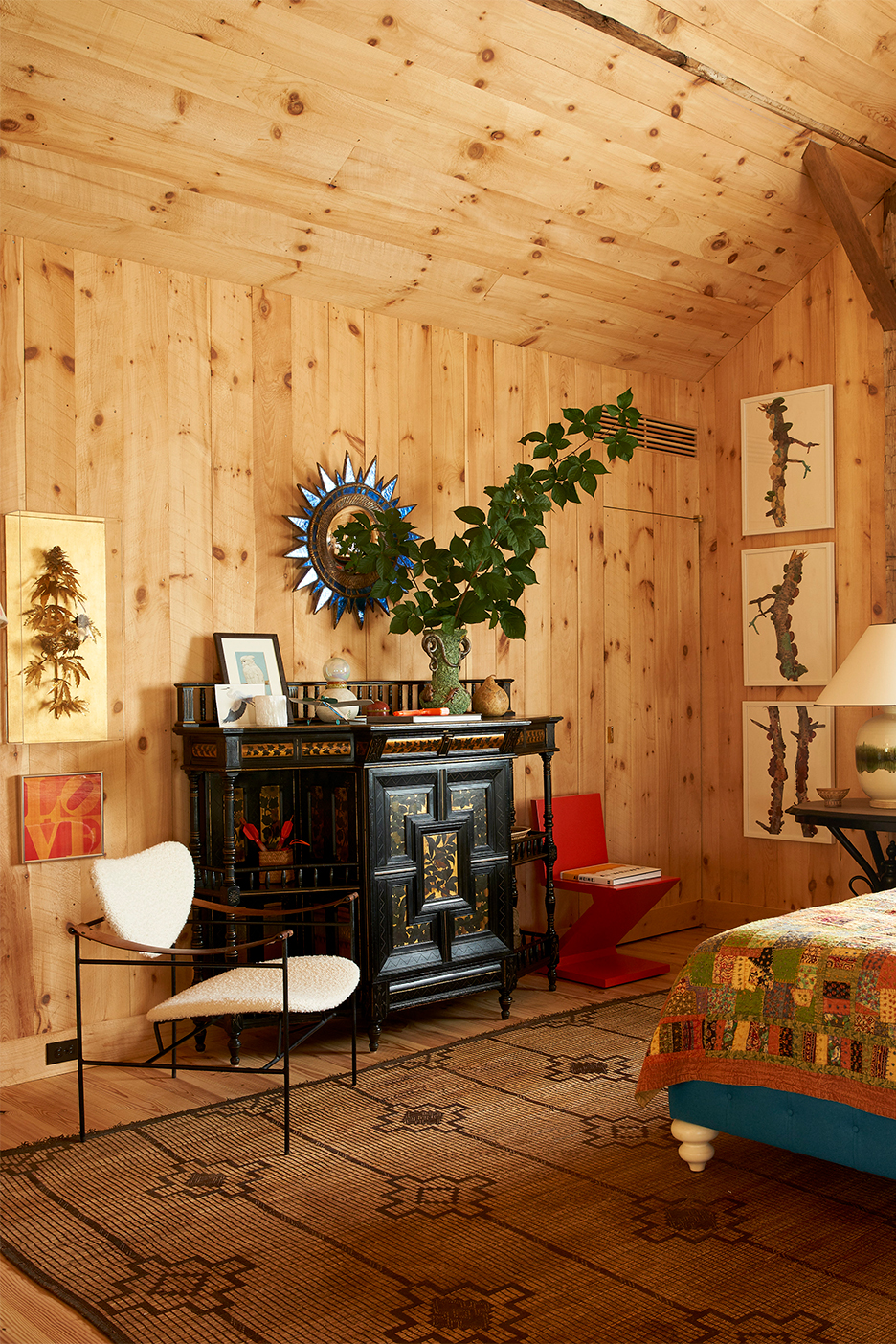 Wood-paneled bedroom with antiques