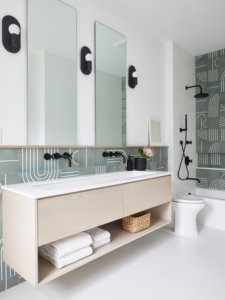 bathroom with pale wood vanity and grey abstract printed tile