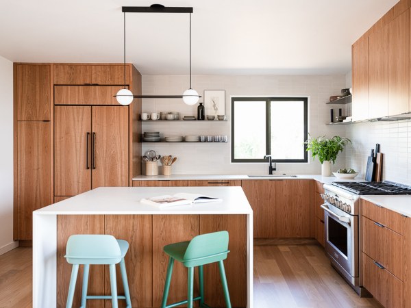 modern wood kitchen with white countertops