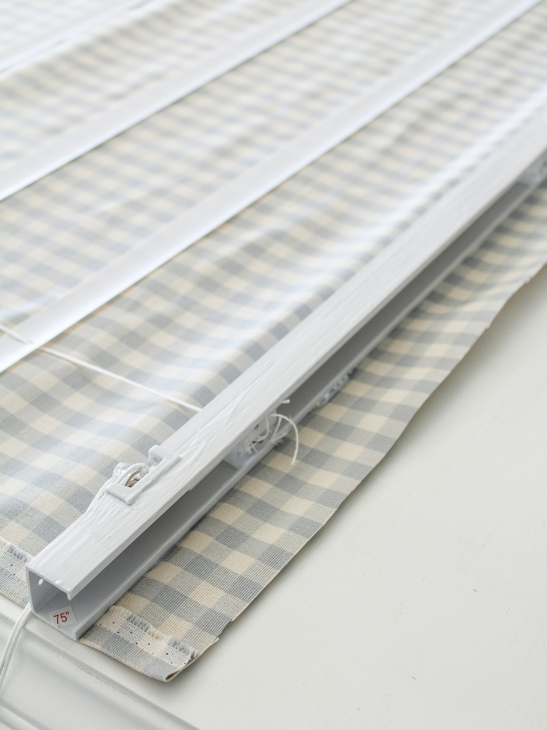 cut up blinds sitting on fabric