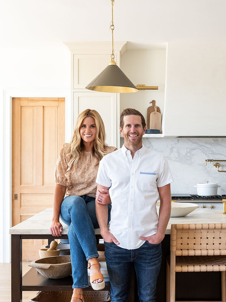 man and woman posing in a kitchen