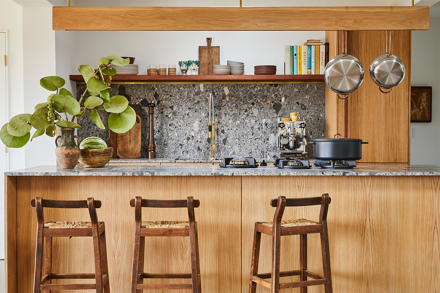 Reform oak kitchen cabinets with gray stone countertops