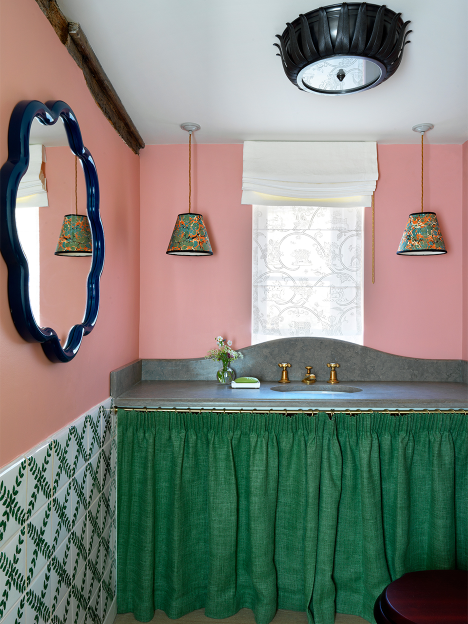 Curved backsplash in pink powder room