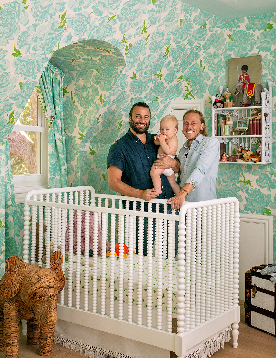 nursery with green floral wallpaper