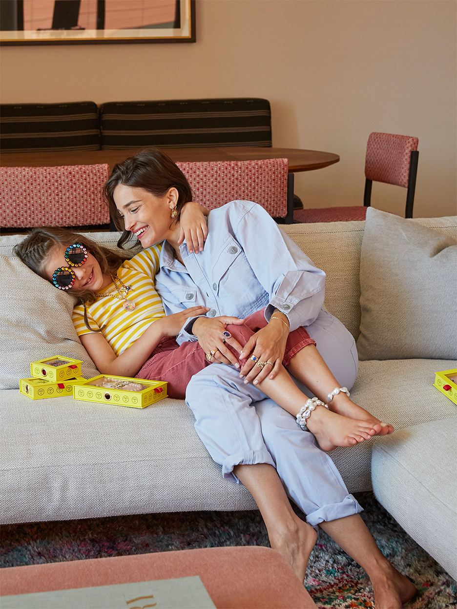 mom and child hugging on sofa