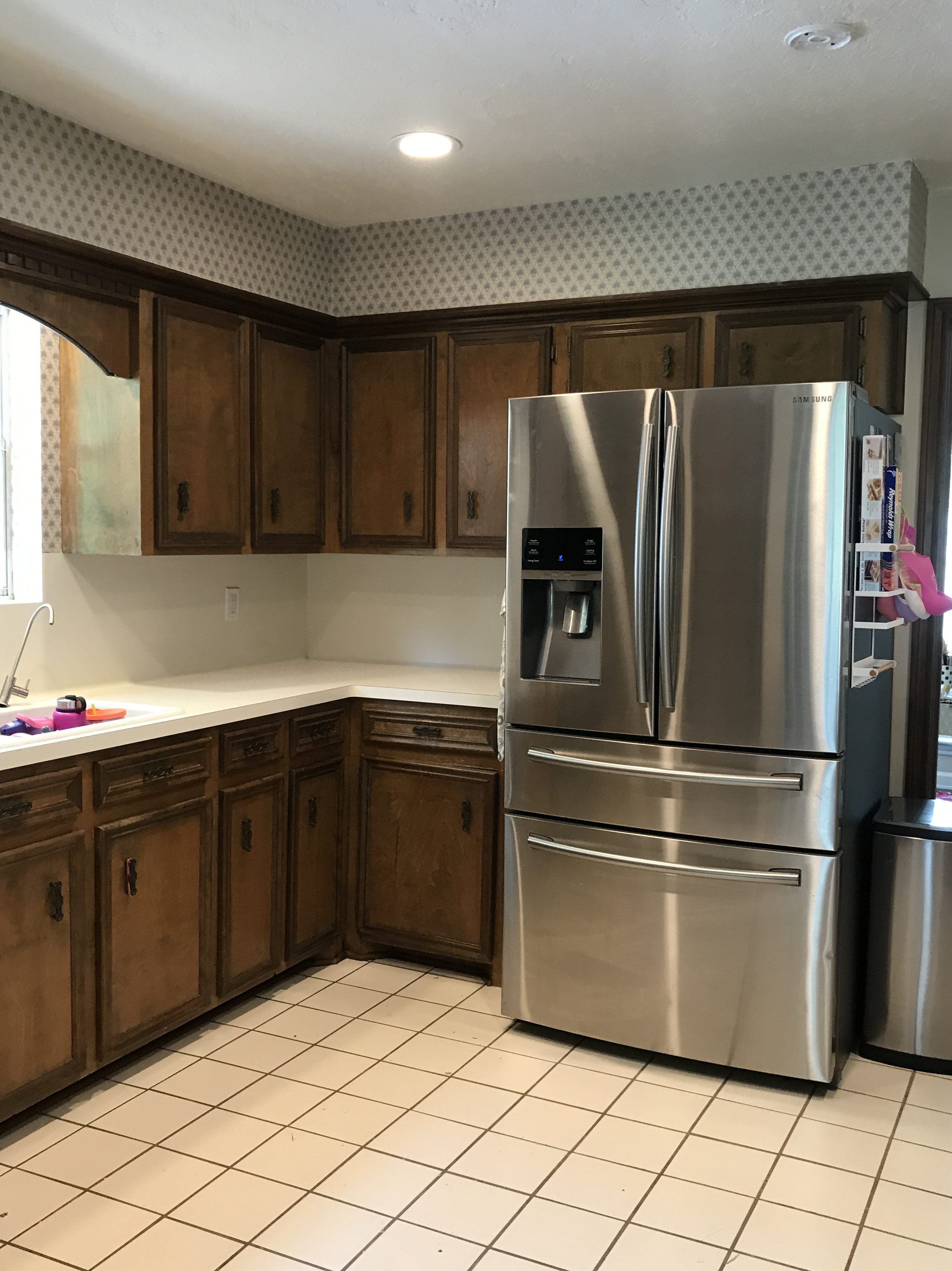 fridge in dated kitchen