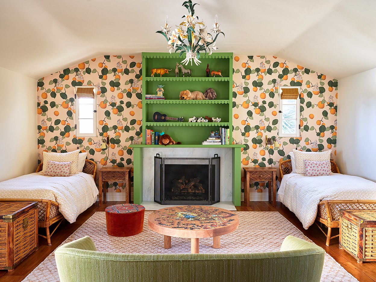 Kids room with wallpaper and green bookcase