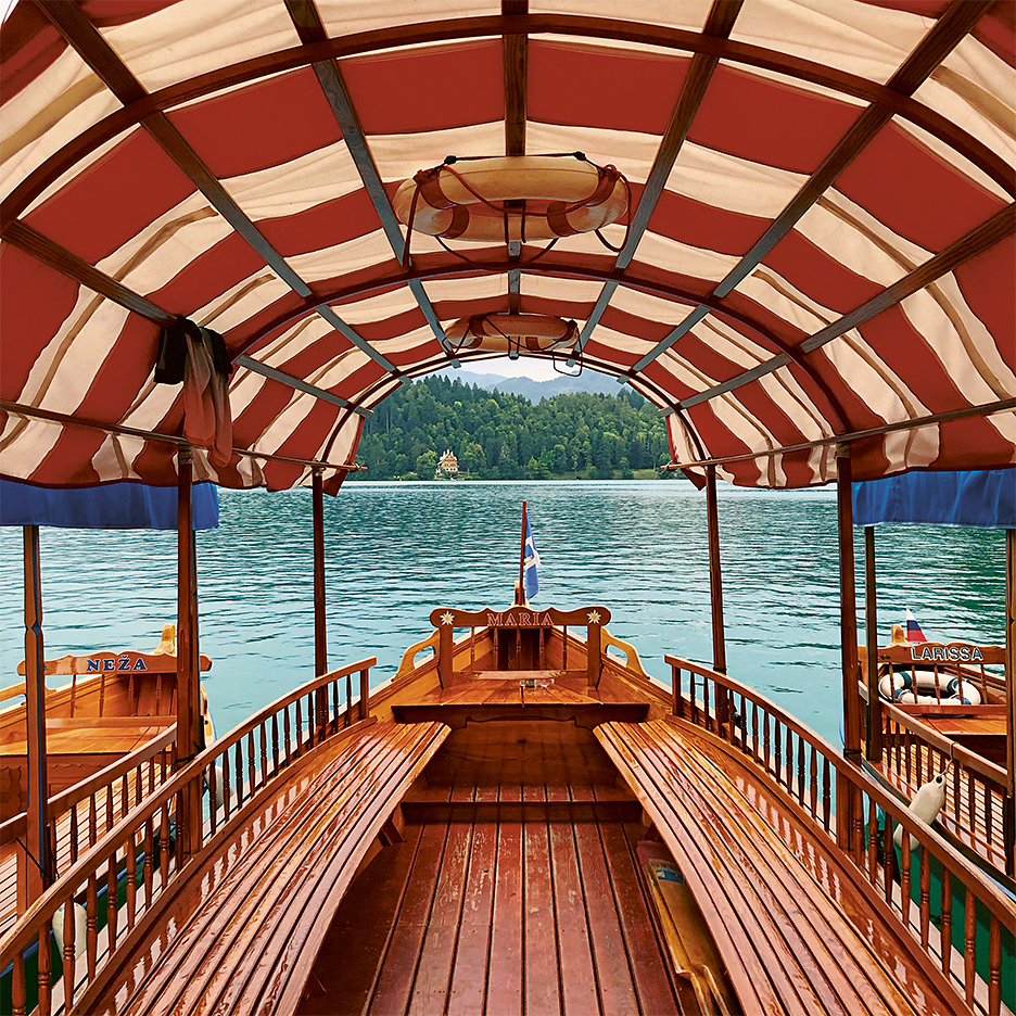 Pletna boat with red striped awning