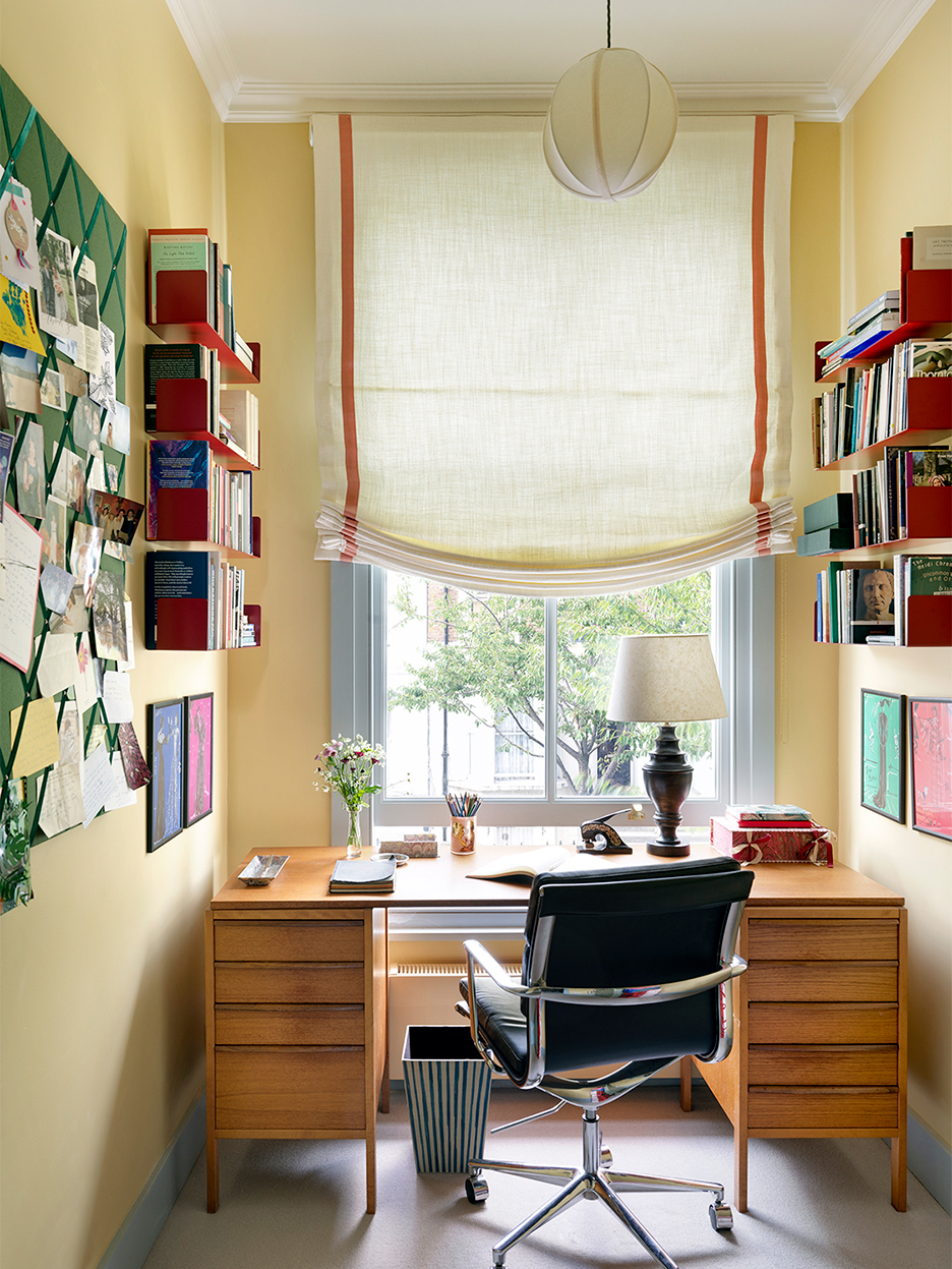Yellow home office with yellow soft roman shade