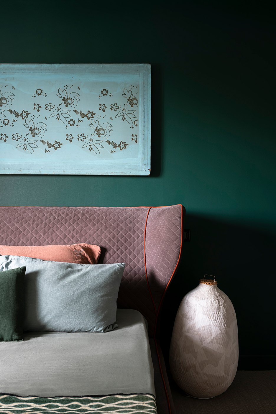 green bedroom with blush pink headboard