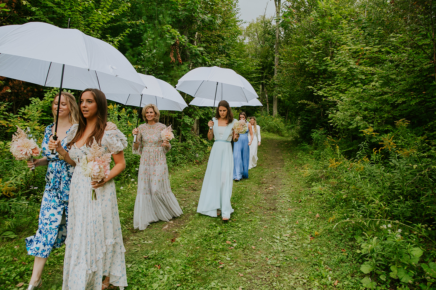 Wedding guests with umbrellas