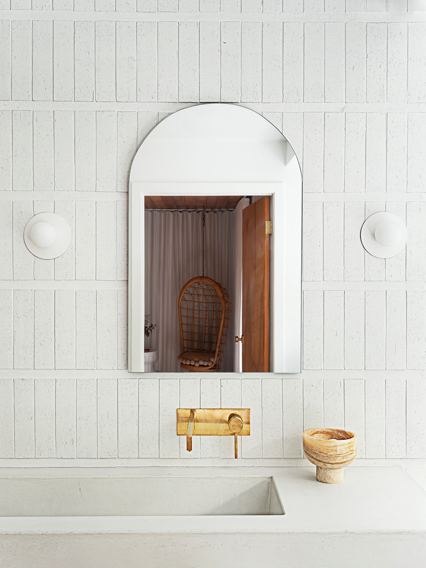 ruved mirror against subway tile