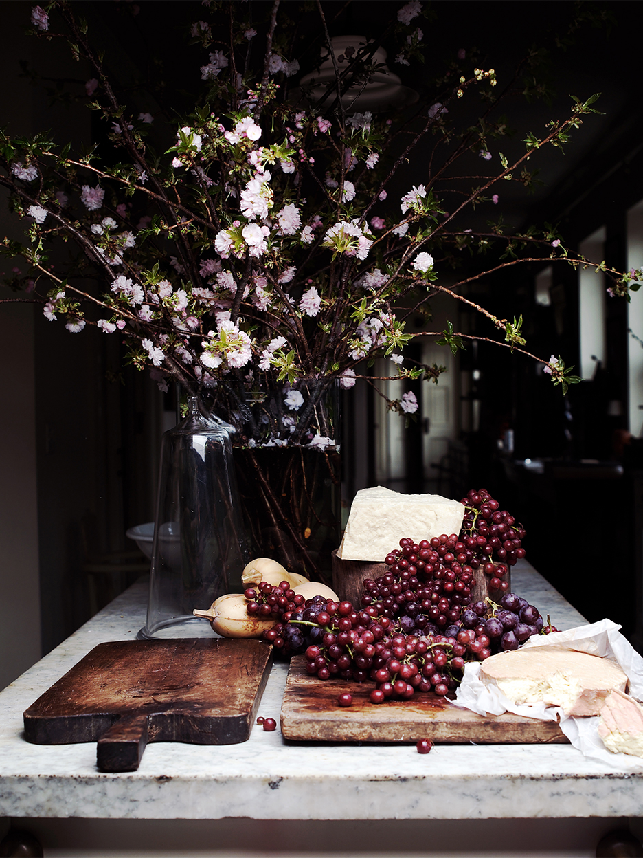 cheese and grapes on table