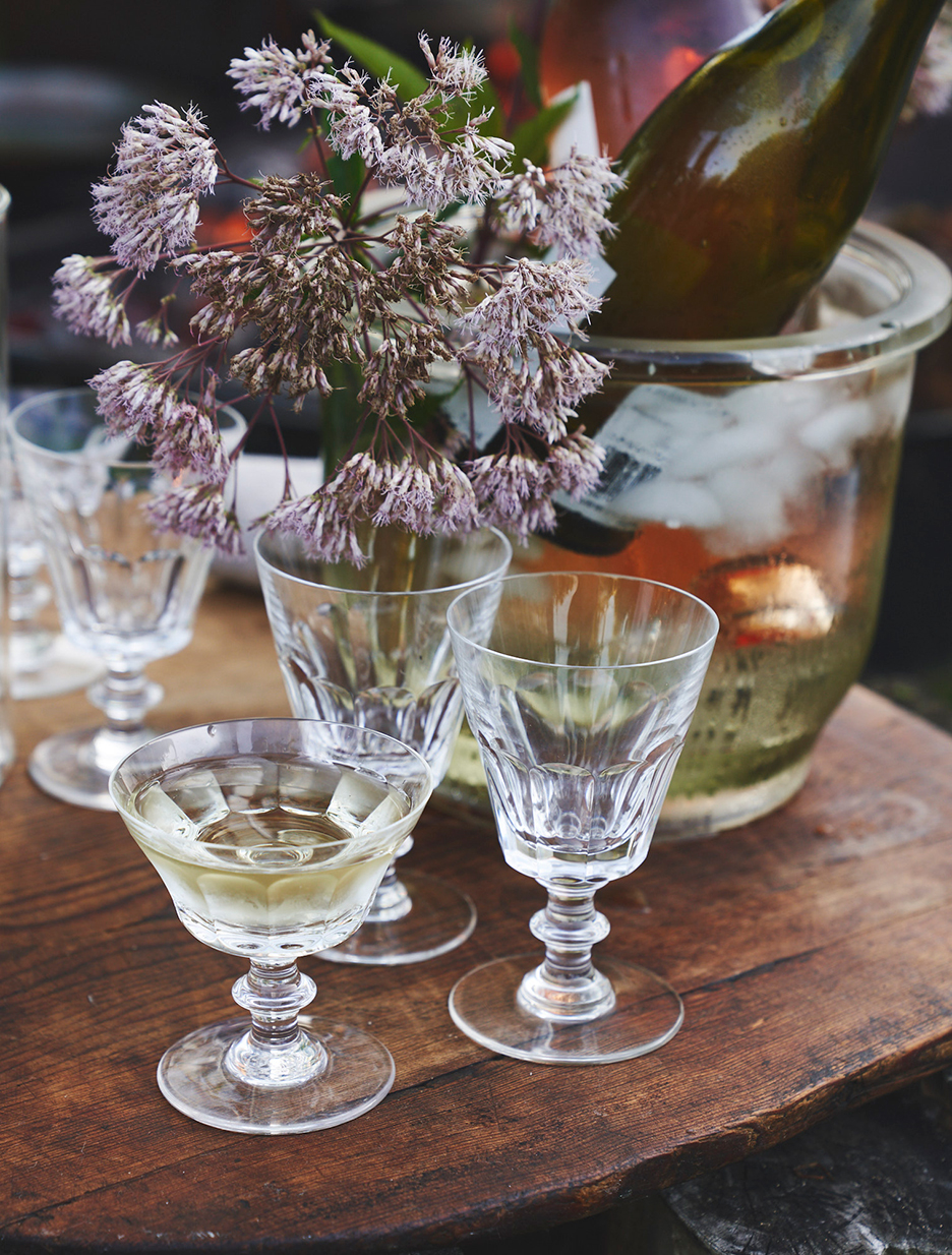 flowers in drinking glasses