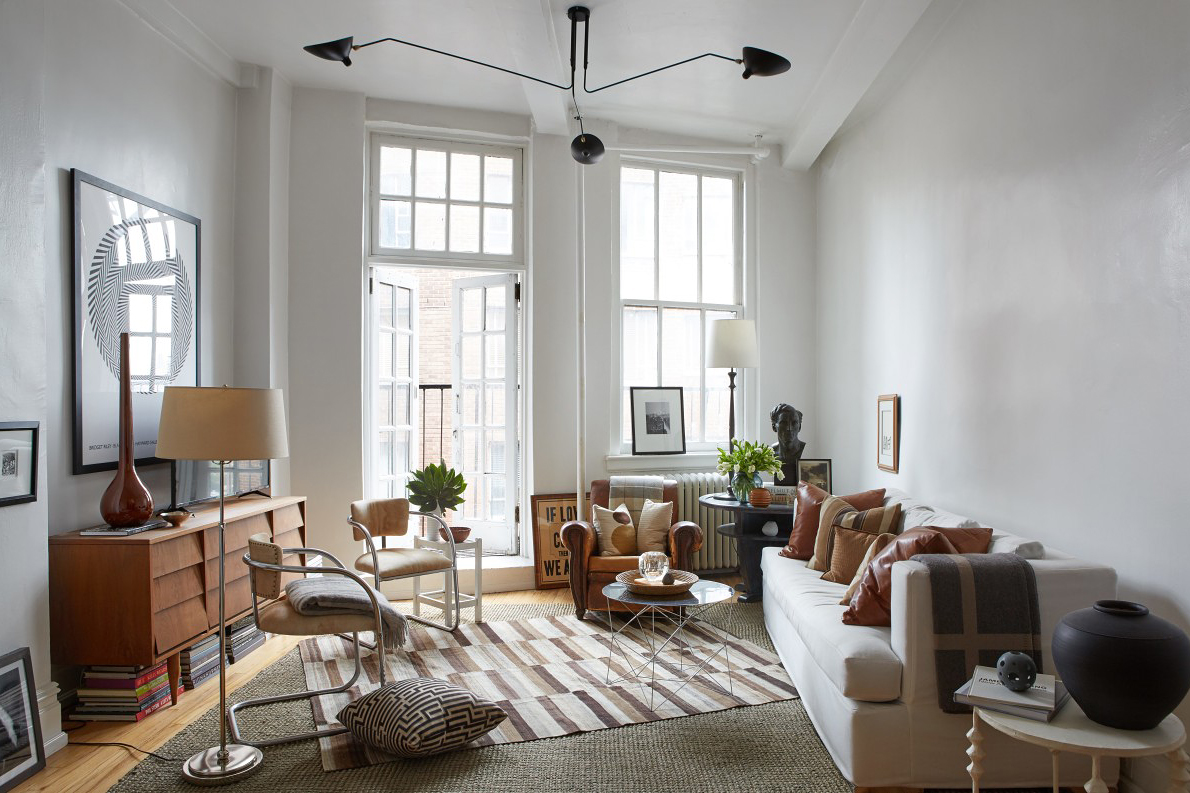 large airy living room with crooked striped rug