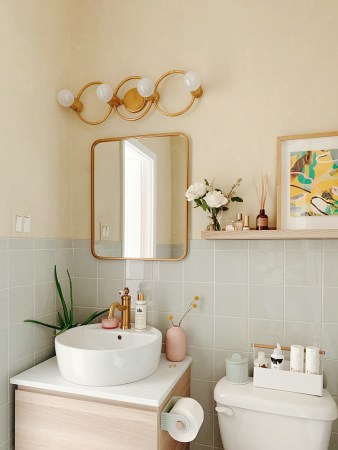 tiny bathroom with green tile walls